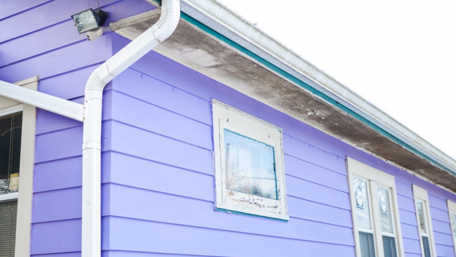 purple house with white gutters